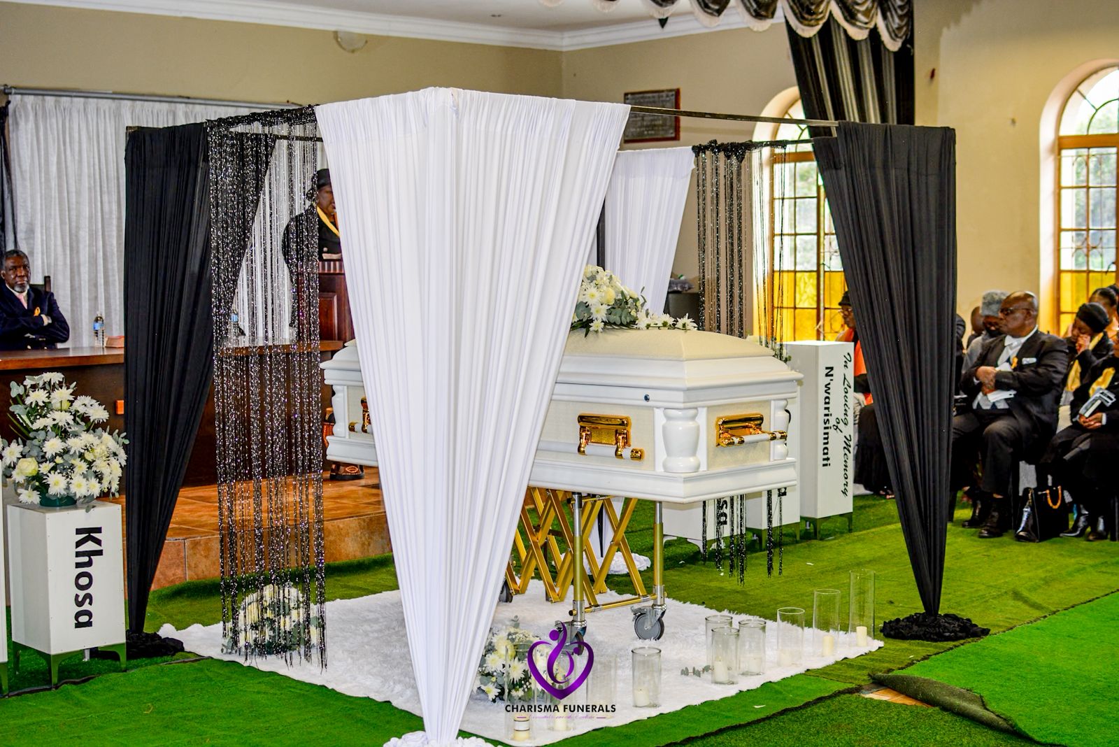 Church funeral service with draped decor